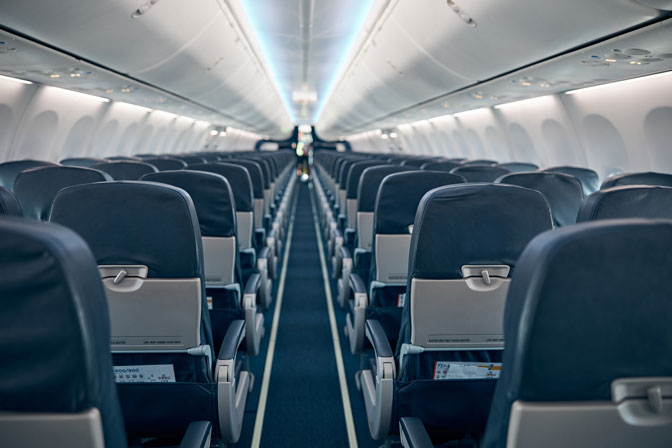airline-passenger-chairs-and-aisle-in-airplane-cab